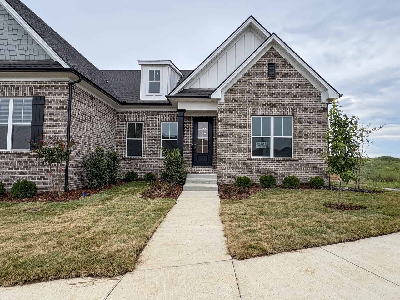 Front exterior of a new home in , Gallatin, TN, highlighting curb appeal (Image 2).