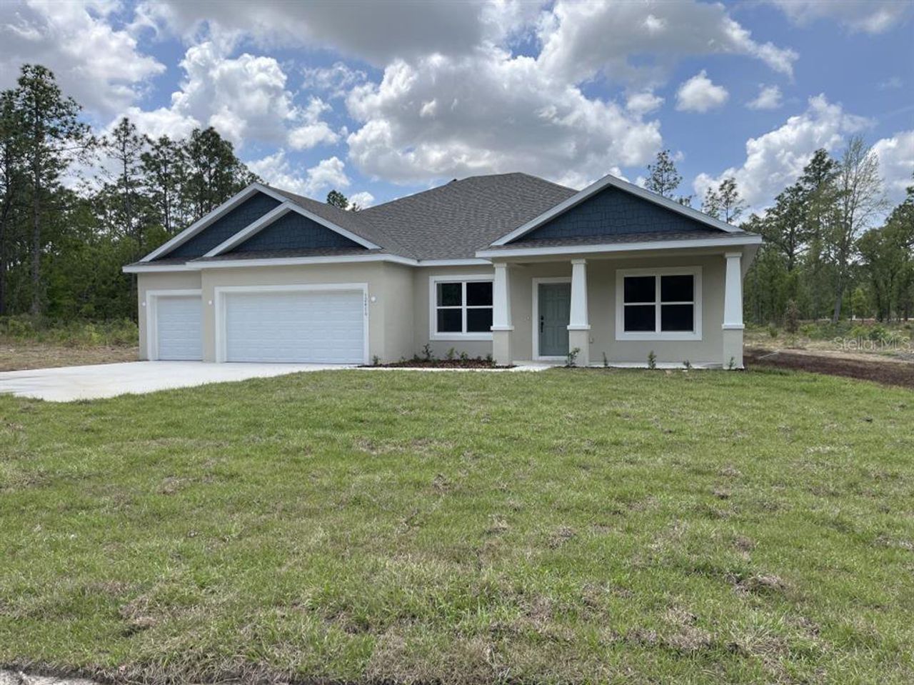 Front exterior of a new home in , Ocala, FL, highlighting curb appeal (Image 2). Front exterior of a new home in , Ocala, FL, highlighting curb appeal (Image 2).