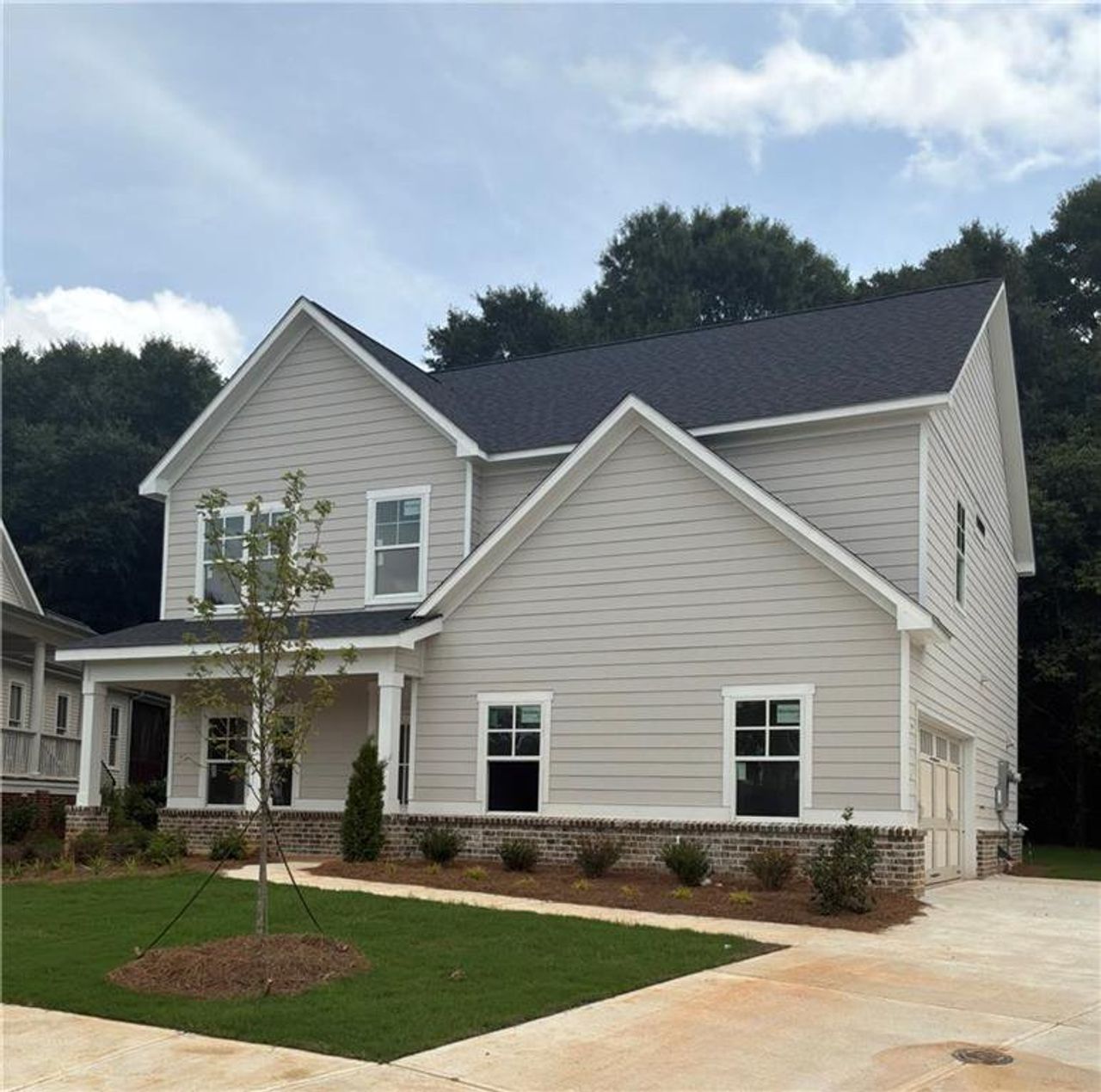 Front exterior of a new home in , Covington, GA, highlighting curb appeal (Image 2). Front exterior of a new home in , Covington, GA, highlighting curb appeal (Image 2).