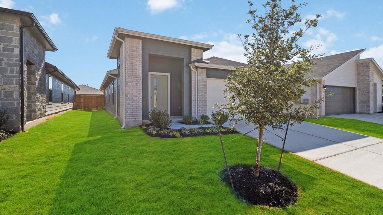 Front exterior of a new home in Southgrove, Kyle, TX, highlighting curb appeal (Image 2). Front exterior of a new home in Southgrove, Kyle, TX, highlighting curb appeal (Image 2).