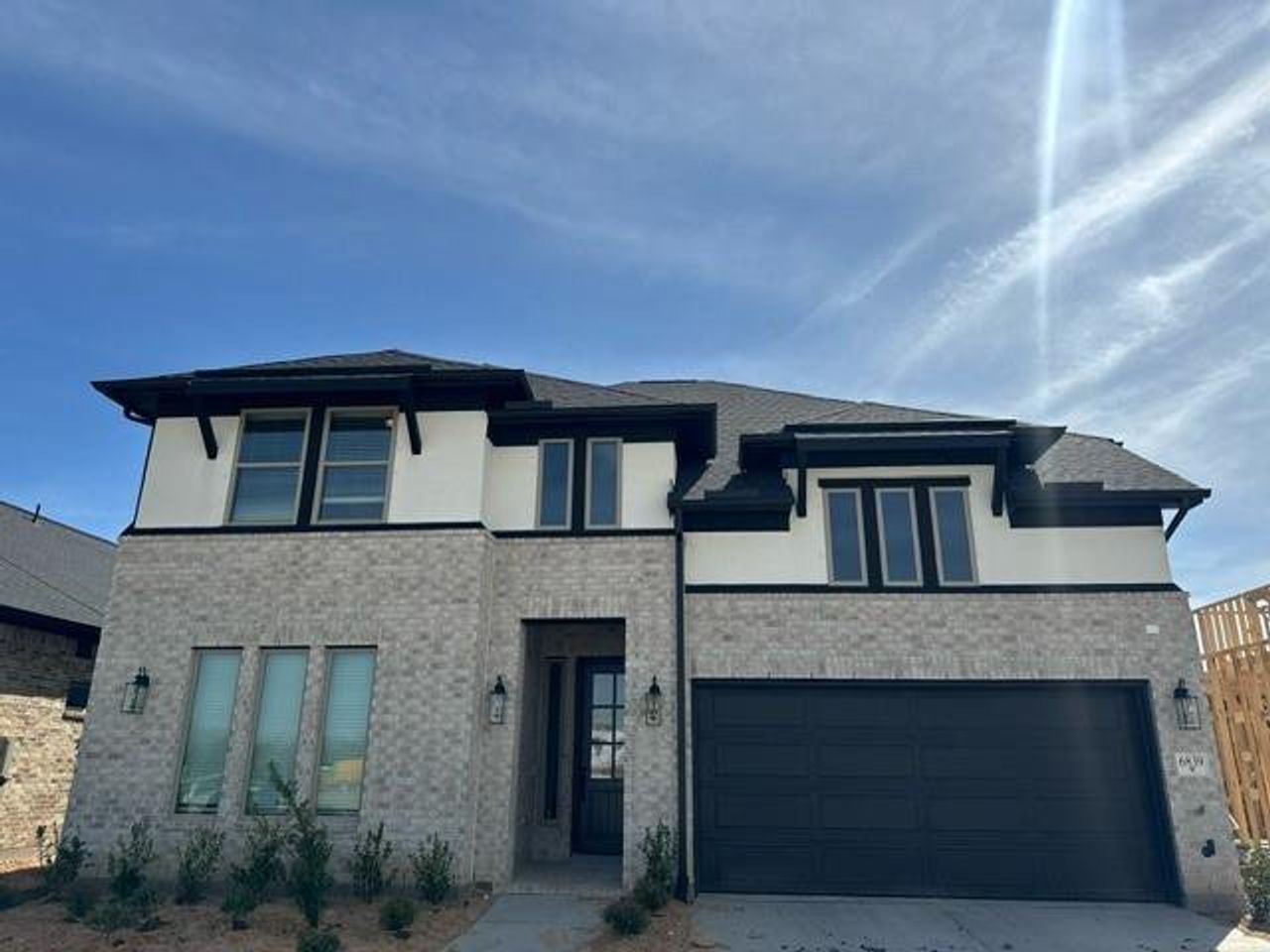 Front exterior of a new home in Legacy, League City, TX, highlighting curb appeal (Image 2).