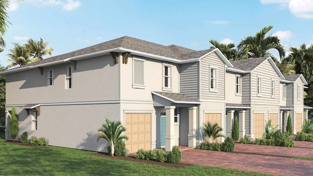 Front exterior of a new home in Central Park Townhomes, Port St. Lucie, FL, highlighting curb appeal (Image 2).
