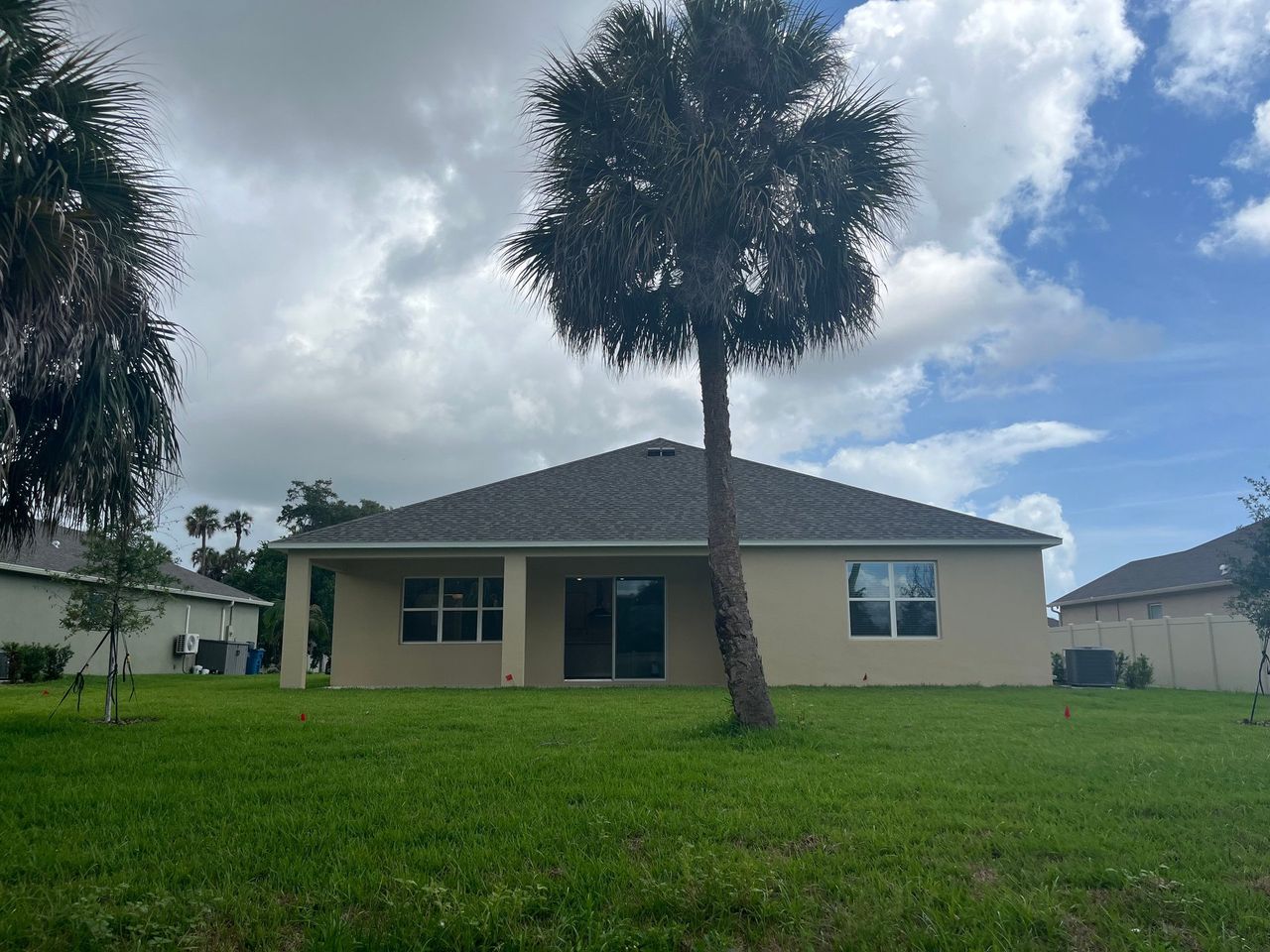 Exterior details and patio area of a home in Country Club Estates, Palm Bay (Image 2).