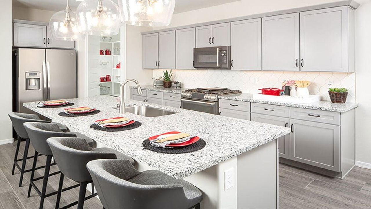 Furnished interior view inside a new home in CantaMia at Estrella 55+, Goodyear (Image 2).