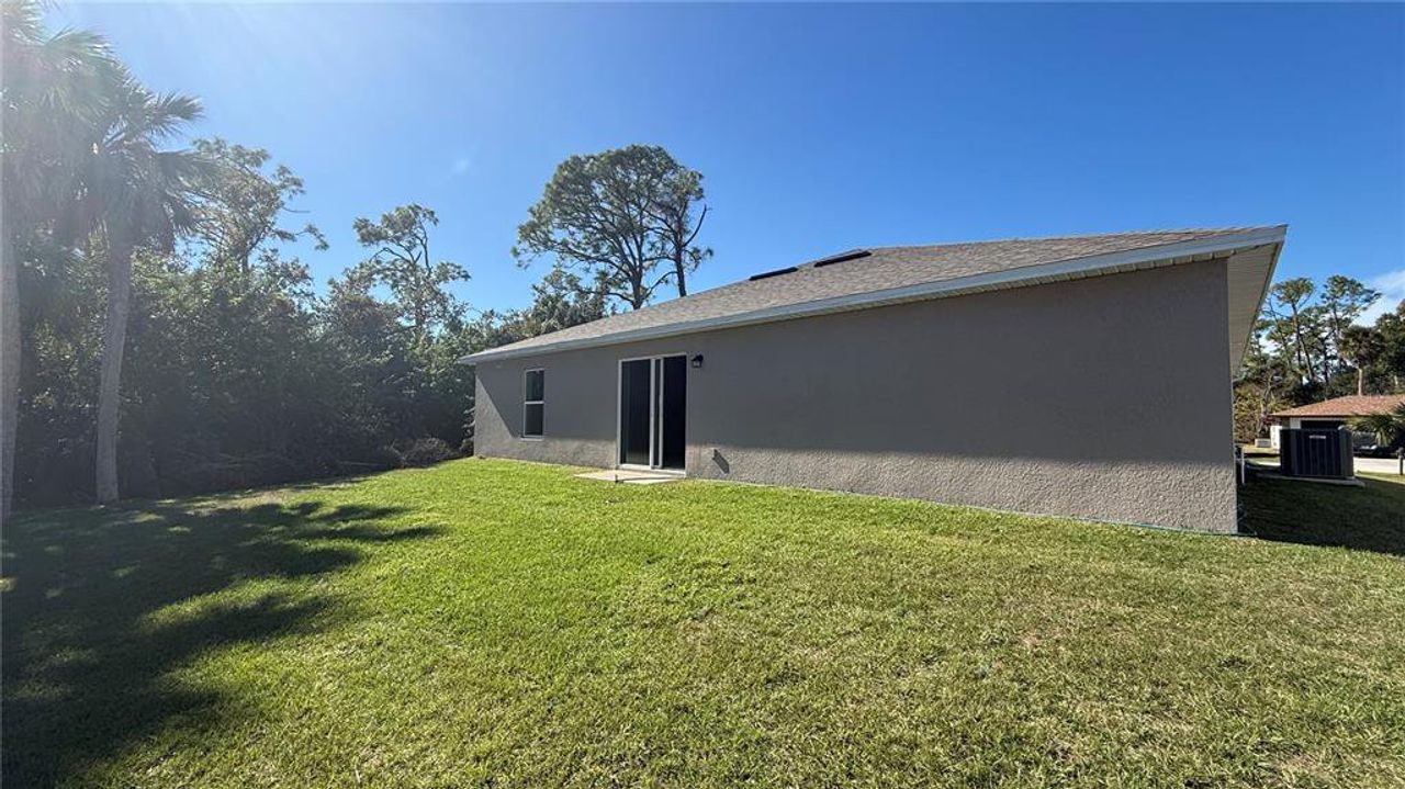 Exterior details and patio area of a home in Port Charlotte, Port Charlotte (Image 2).