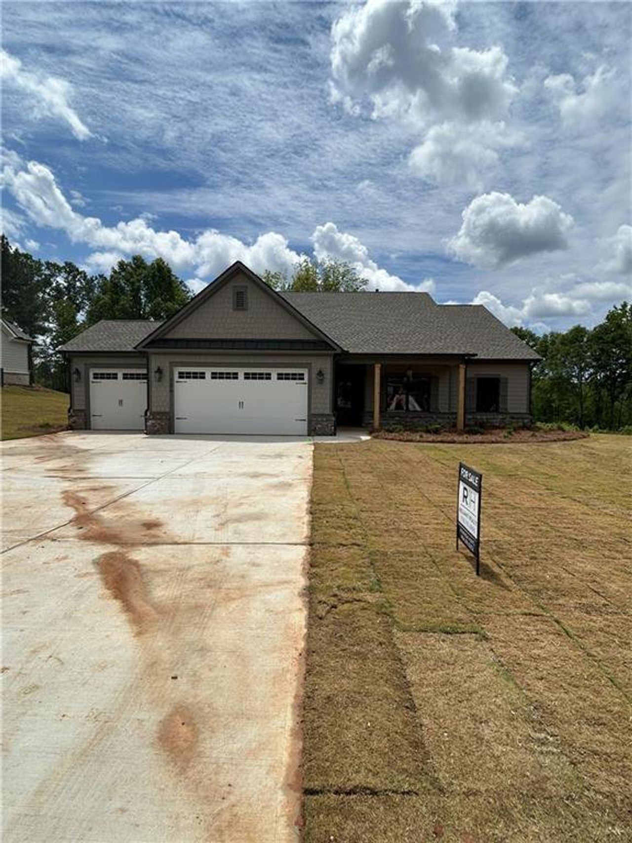Front exterior of a new home in Riverwalk, Monroe, GA, highlighting curb appeal (Image 2).