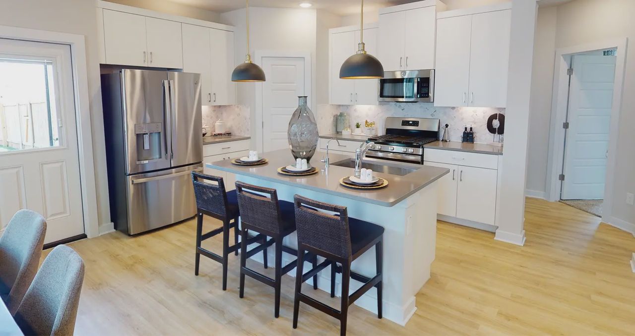 Representative furnished interior of a home built from the Kenley by Chesmar Homes in Nolina, Georgetown (Image 2).