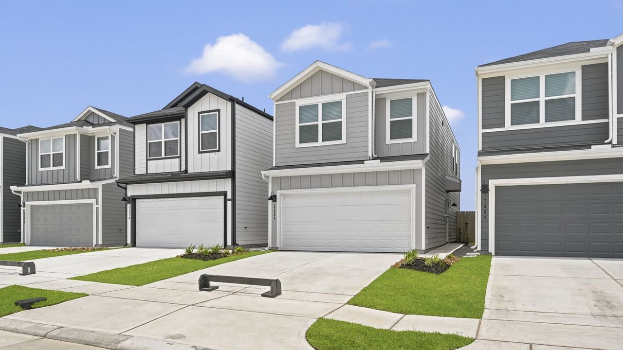 Front exterior of a new home in Bridges on Lake Houston Villas, Humble, TX, highlighting curb appeal (Image 2).