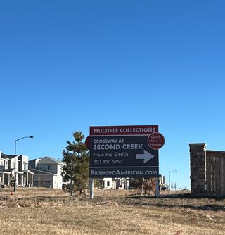 Modern homes in Crossway at Second Creek by Richmond American Homes, set against clear skies in Commerce City, CO.