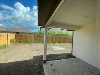 Model Home A spacious, fenced backyard in the Sandrock Station community by First America Homes, Houston, TX.