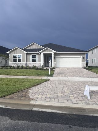 A charming single-story home with a paved driveway in TrailMark by Richmond American Homes (St. Augustine, FL).