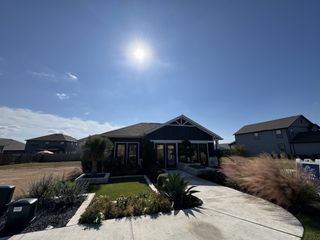 A charming home with a landscaped front yard in Eastwood at Sonterra by Pacesetter Homes, Jarrell, TX.