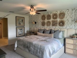 A cozy bedroom featuring modern decor, a statement wall, and plush bedding for a stylish and comfortable retreat.