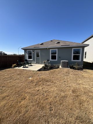 Charming home with a spacious yard and patio in Spanish Trails Villas by KB Home (San Antonio, TX).