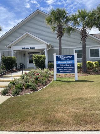A charming welcome center with lush landscaping at Cresswind Charleston by Kolter Homes in Summerville, SC.