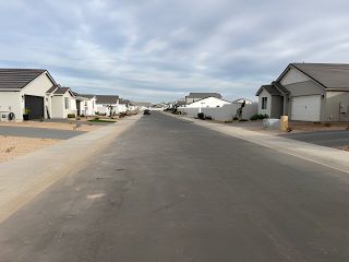 Street view A tranquil street view of modern homes in Pecan Cove by Newport Homes, located in San Tan Valley, AZ.