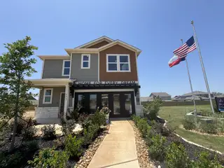Street view Charming modern home with landscaped garden in Hacienda by Century Communities (San Antonio, TX).