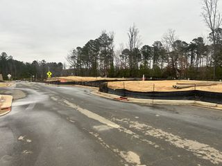 A developing neighborhood with roads and sidewalks taking shape in Twyla Walk by Stanley Martin Homes (Cary, NC).
