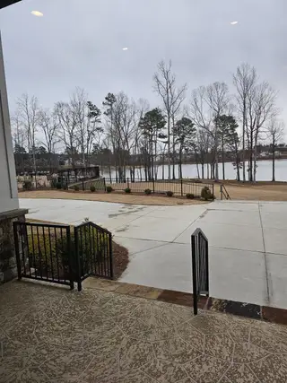 A state-of-the-art fitness center with lake views in Cresswind Georgia at Twin Lakes by Kolter Homes (Hoschton, GA).