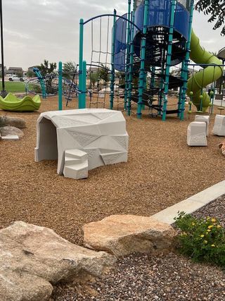Community Amenities A vibrant playground with climbing structures and slides in Allen Ranches: Expedition Collection by Taylor Morrison (Litchfield Park, AZ).