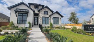 Charming stone and brick home with lush landscaping in Arcadia Ridge 50' by Perry Homes, San Antonio, TX.