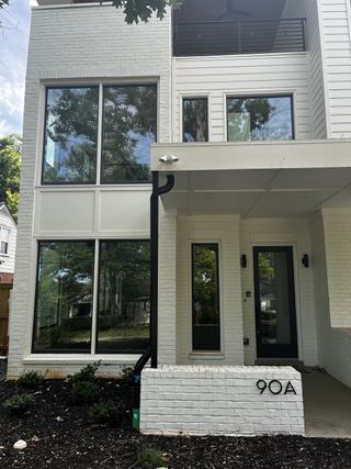 Modern white brick home with expansive windows in Alley of Edgewood by Goodman Design (Atlanta, GA).