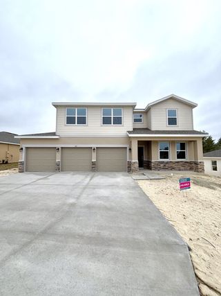 A modern two-story home with a three-car garage in Brookshire by Stanley Martin Homes (Titusville, FL).