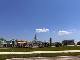 A vibrant new development in Wellness Ridge: Manor Collection by Lennar with modern homes and a serene park setting (Clermont, FL).