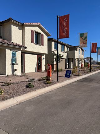 A charming row of modern homes with landscaped yards in Harvest at Citrus Park by Landsea Homes, Goodyear, AZ.