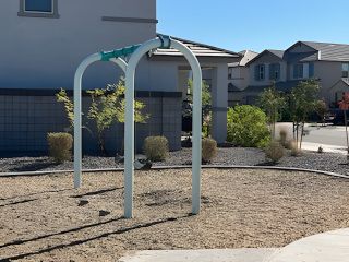 A contemporary home with a unique playground element in Mason Ranch II by D.R. Horton, Surprise, AZ.