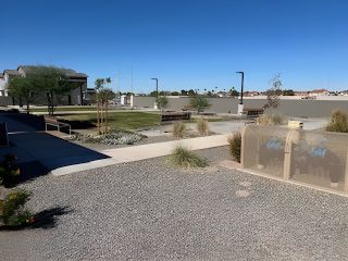 A modern community with landscaped paths in Hawes Crossing: Reflection by Lennar (Mesa, AZ).