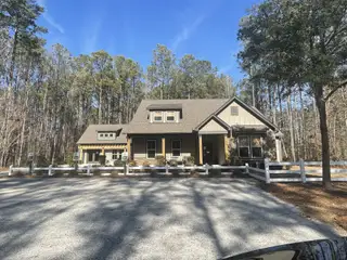 Charming rustic home with wooded backdrop in Carolina Bay by Center Park Homes (Ridgeville, SC).