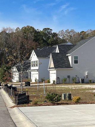 Charming modern homes with gray facades in Magnolia Pointe by Eastwood Homes, North Charleston, SC.