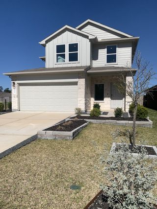 A charming modern home with a manicured yard in Breckenridge Forest by D.R. Horton (Spring, TX).