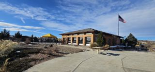 A charming community center with a yellow gazebo in Rhyolite Ranch by Kauffman Homes (Castle Rock, CO).