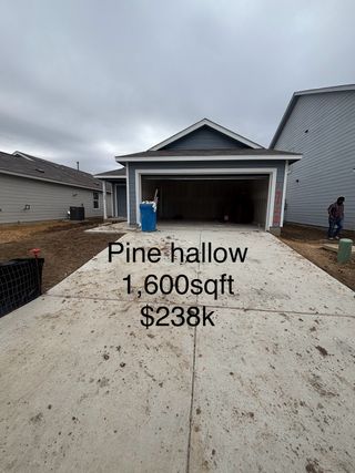 A charming gray home with a spacious driveway in Brookmill: Stonehill Collection by Lennar (San Antonio, TX).