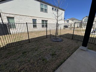 Model Home A private fenced backyard with a scenic view, offering an ideal space for outdoor relaxation.