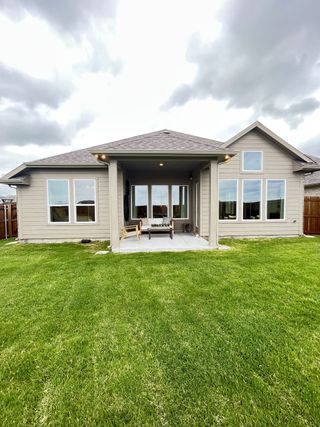 Street view A charming modern home with large windows and a lush backyard in Elevon by Pacesetter Homes (Lavon, TX).