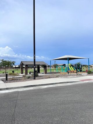 A vibrant community park with a playground in Canyon Views by Starlight Homes, Litchfield Park, AZ.