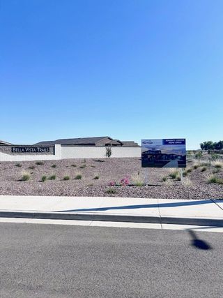 Street view A scenic view of Bella Vista Trails Estate Series by Meritage Homes showcasing a landscaped entrance in San Tan Valley, AZ.