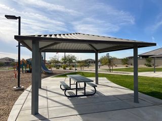 Community Amenities Covered pavilion and playground in the Village at Sundance by Centex, Buckeye, AZ, perfect for outdoor enjoyment.