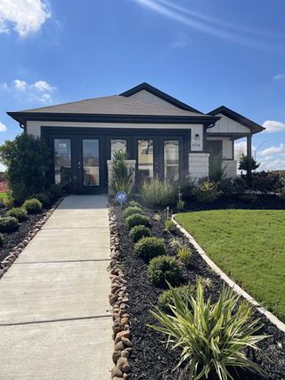 A charming modern home with sleek design and landscaped garden in Mesa Vista by Century Communities (Von Ormy, TX).
