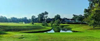 A picturesque landscape with a pond and lush greenery in Sienna 65' by Shea Homes, Missouri City, TX.