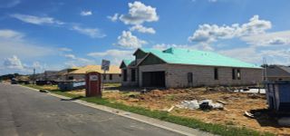 A modern new construction home with a fresh green roof in Leela Reserve by Park Square Residential (Tavares, FL).
