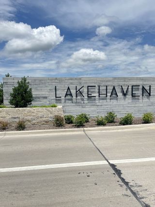 Entrance to Lakehaven community with modern signage and landscaping by Trophy Signature Homes in Farmersville, TX.