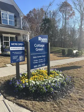 Street view Charming home with manicured garden and vibrant flowers in Cottage Green by Ryan Homes (Monroe, NC).
