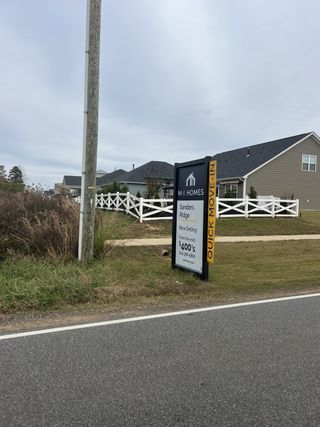 Charming homes with a rustic fence in Sanders Ridge by M/I Homes, set in scenic Troutman, NC.