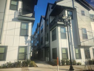 A modern townhome community under construction, soon offering stylish urban residences in Johnson Commons by Breeze Homes (Jacksonville, FL).