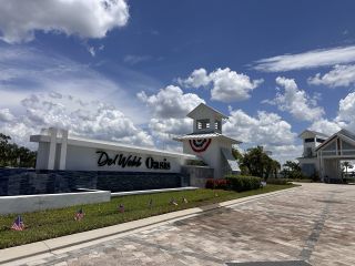 A welcoming entrance with crisp white exteriors in Del Webb Oasis by Del Webb, Winter Garden, FL.