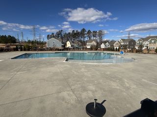 Inviting community pool area surrounded by charming homes in Bryton by Pulte Homes, Huntersville, NC.